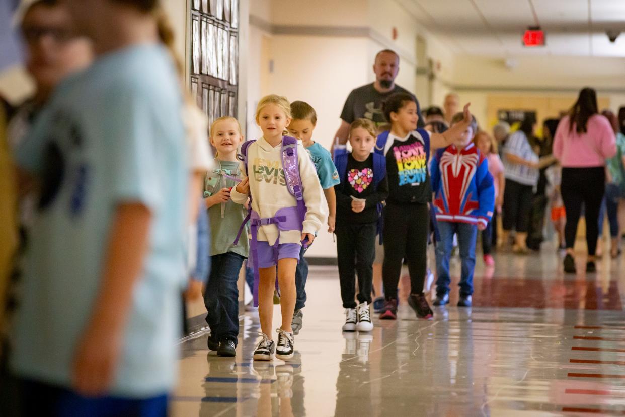 Students walk to classes during the first day of school at Malabon Elementary School on Tuesday.