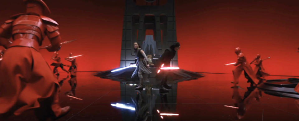 Kylo Ren and Rey engaged in a lightsaber battle with Praetorian Guards in a scene from Star Wars