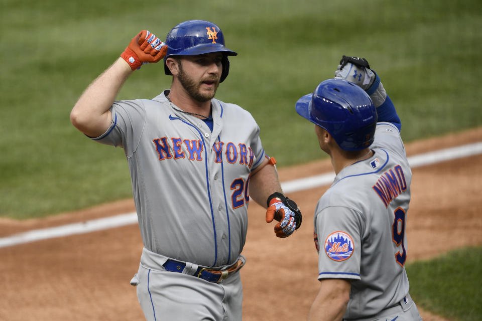 New York Mets' Pete Alonso, left, celebrates his two-run home run with Brandon Nimmo (9) during the first inning of a baseball game against the Washington Nationals, Sunday, Sept. 27, 2020, in Washington. (AP Photo/Nick Wass)