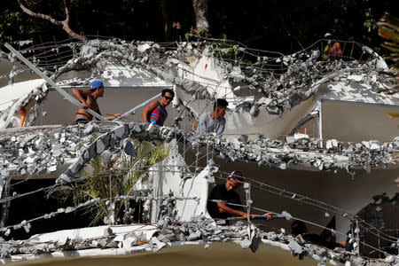 Filipino workers demolish West Cove resort two days before the temporary closure of the holiday island Boracay in the Philippines April 24, 2018. Picture taken April 24, 2018. REUTERS/Erik De Castro