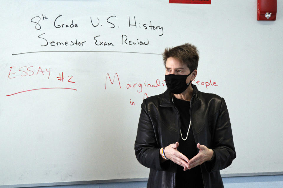 History teacher Wendy Leighton discusses the Salem witch trials with her students at Monte del Sol Charter School Friday, Dec. 3, 2021, in Santa Fe, N.M. Leighton is one of dozens of educators who helped draft state's proposed changes to the social studies curriculum, including adding the Sept. 11 attacks and the history of LGBTQ rights. It would increase the focus on ethnic studies in a state where 49 percent of the population is Hispanic, and 11 percent is Indigenous. (AP Photo/Cedar Attanasio)