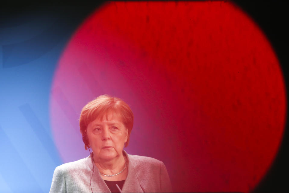 German Chancellor Angela Merkel listens to Hungary's Prime Minister Victor Orban during a joint statement prior to a meeting at the chancellery in Berlin, Germany, Monday, Feb. 10, 2020. (AP Photo/Markus Schreiber)