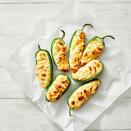 <p>Stuff jalapeños with our cream cheese, Cheddar and scallion mixture for a classic game day snack that guests will love.</p><p>Get the <strong><a href="https://www.goodhousekeeping.com/food-recipes/a42298317/air-fryer-jalapeno-poppers-recipe/" rel="nofollow noopener" target="_blank" data-ylk="slk:Air Fryer Jalapeño Poppers recipe;elm:context_link;itc:0;sec:content-canvas" class="link ">Air Fryer Jalapeño Poppers recipe</a></strong>.</p>