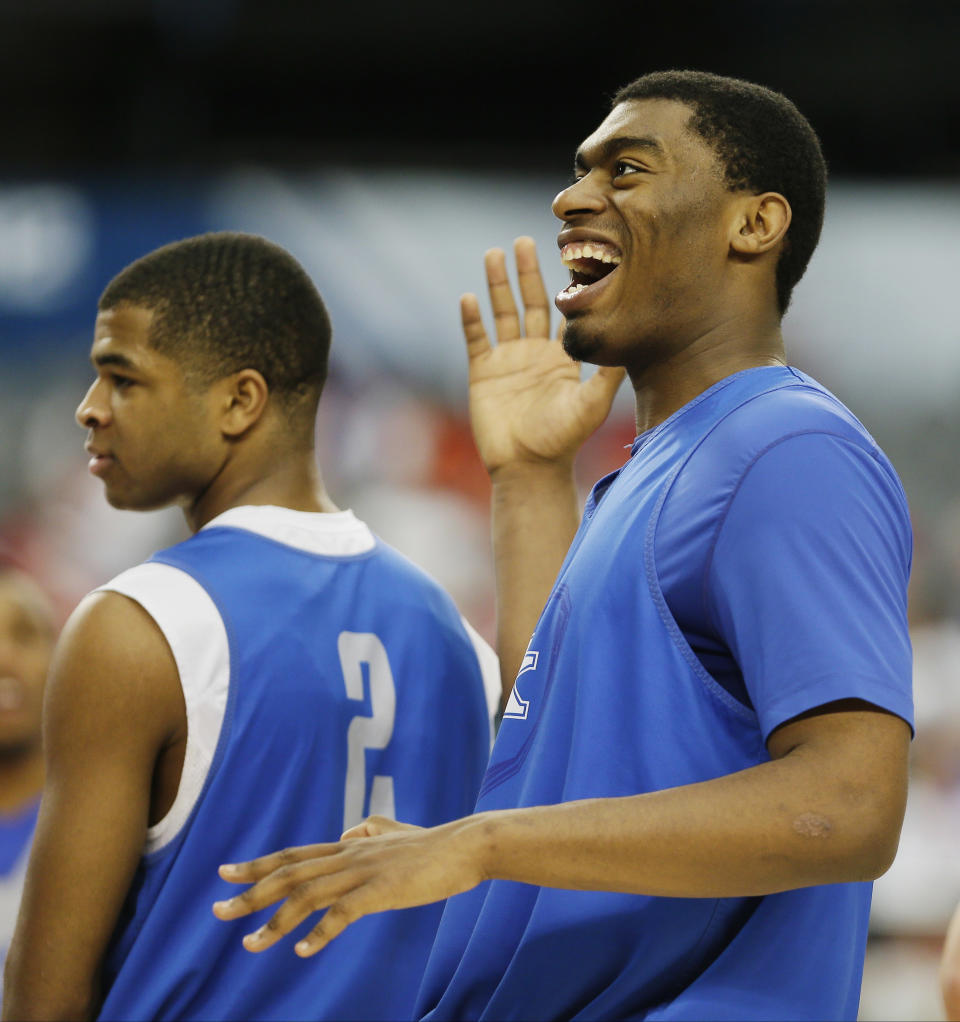 Kentucky guard Aaron Harrison, left and center Dakari Johnson react during practice for their NCAA Final Four tournament college basketball semifinal game Friday, April 4, 2014, in Dallas. Kentucky plays Wisconsin on Saturday, April 5, 2014. (AP Photo/Charlie Neibergall)