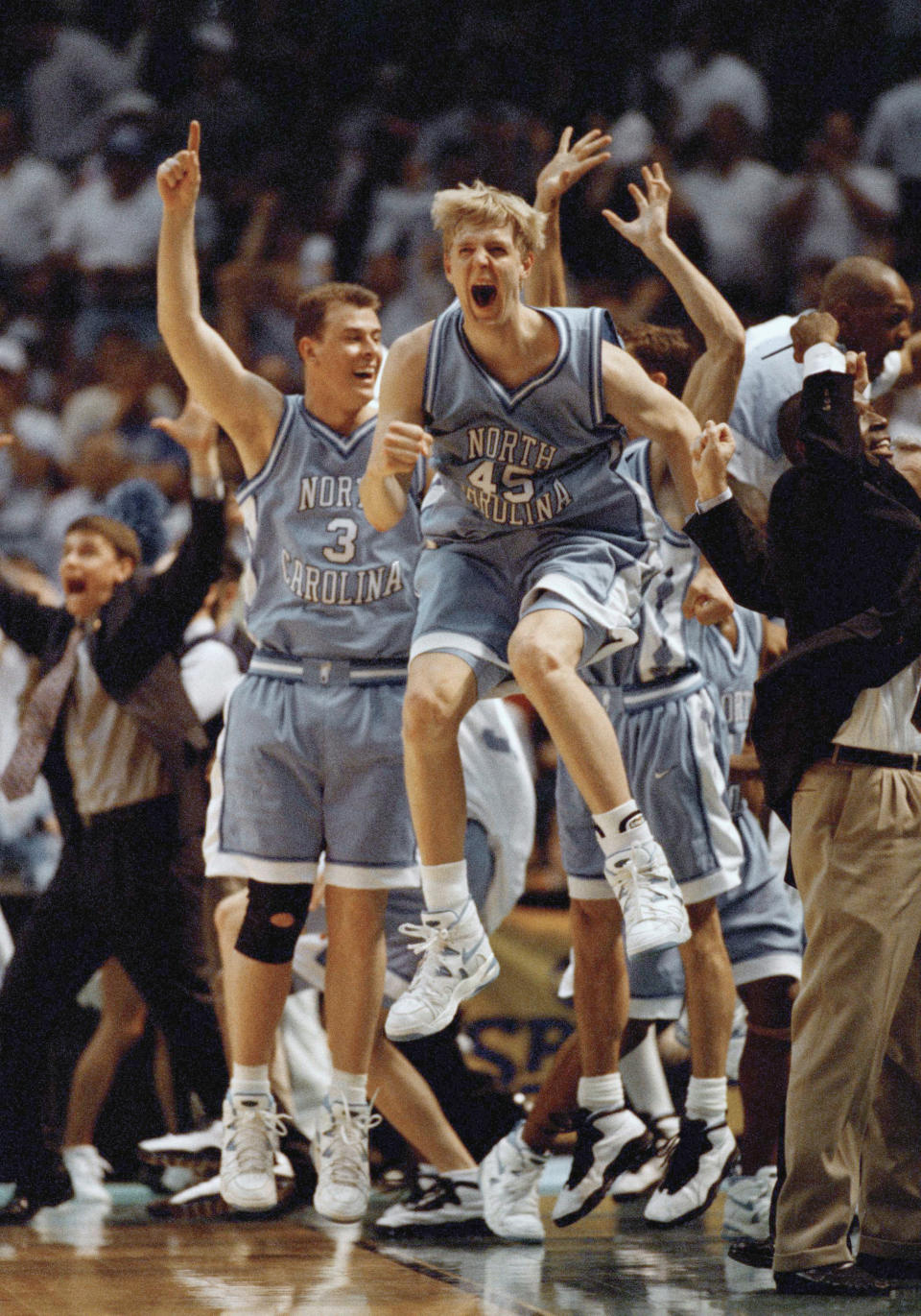 FILE - North Carolina's Serge Zeikker (45) goes airborne as the Tar Heels beat Kentucky 74-61 in NCAA Southeast Regional Championship, March 25, 1995, at the Birmingham-Jefferson Civic Center in Birmingham, Alabama. The victory put the Tar Heels in the Final Four. (AP Photo/Bob Jordan, File)