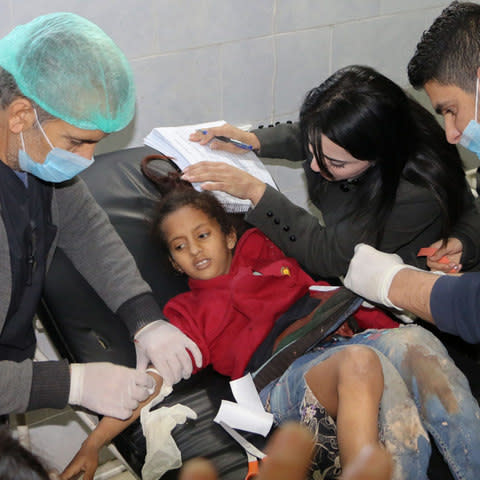 An injured girl receives treatment at the Avrin hospital in the Kurdish-majority town of Afrin in northern Syria - Credit: AFP