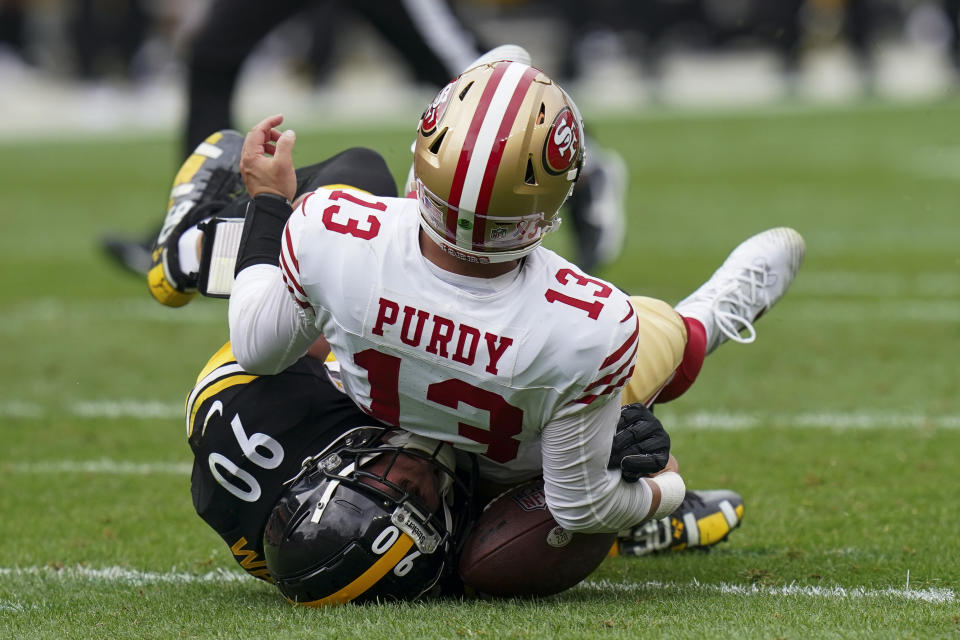 Pittsburgh Steelers linebacker T.J. Watt, left, sacks San Francisco 49ers quarterback Brock Purdy during the first half of an NFL football game, Sunday, Sept. 10, 2023, in Pittsburgh. (AP Photo/Matt Freed)