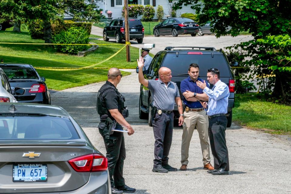 A Johnston police cruiser blocks Ligian Court, the scene of a police investigation. Mayor Joseph Polisena Jr. announced that a suspect had been apprehended in a triple shooting.