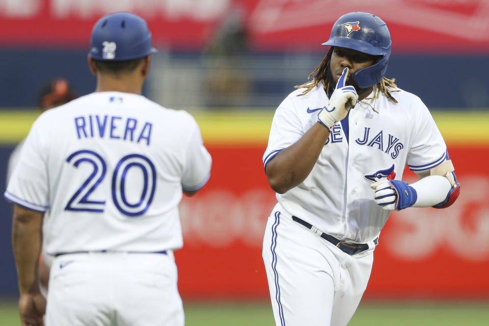 Toronto Blue Jays' Vladimir Guerrero Jr., right, celebrates his home run during the second inning of a baseball game against the Baltimore Orioles in Buffalo, N.Y., Thursday, June 24, 2021. (AP Photo/Joshua Bessex)