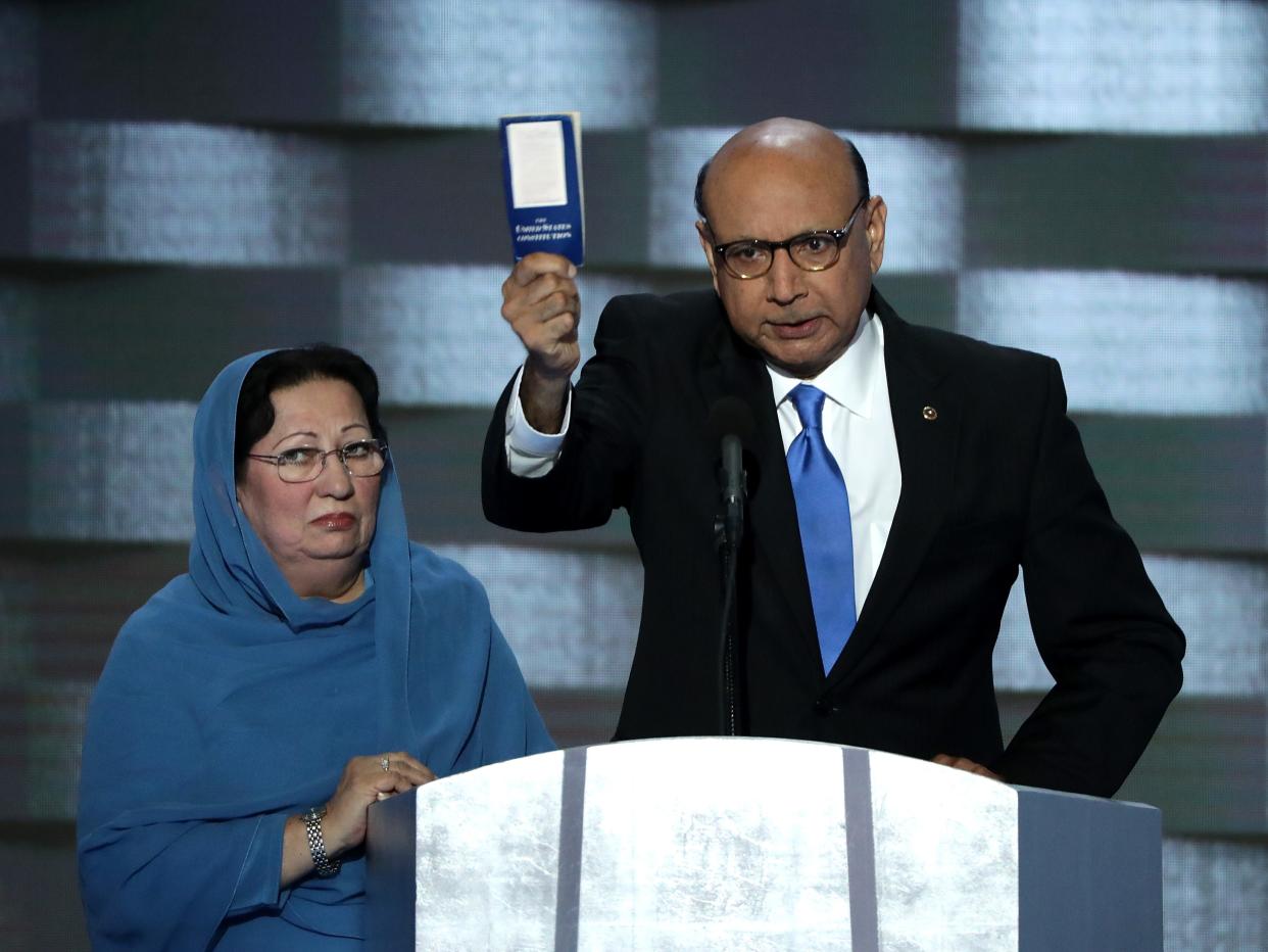 Khizr Khan, father of deceased Muslim U.S. Soldier Humayun S. M. Khan, holds up a booklet of the US Constitution as he delivers remarks on the fourth day of the Democratic National Convention at the Wells Fargo Center, July 28, 2016 in Philadelphia, Pennsylvania.