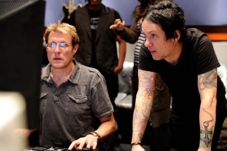 In this 2011 file photo, Chris Vrenna, right, works with recording engineer Eich Mouser at a Los Angeles recording studio. (Getty Images)