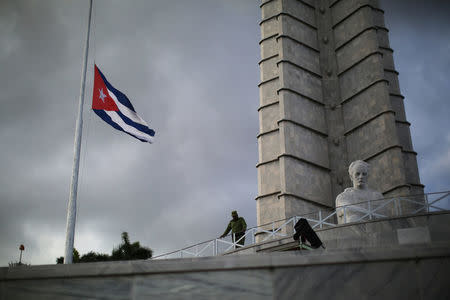 A soldier stands at Revolution Square as a Cuban flag flies at half mast, following the announcement of the death of Cuban revolutionary leader Fidel Castro, in Havana, Cuba November 27, 2016. REUTERS/Carlos Barria