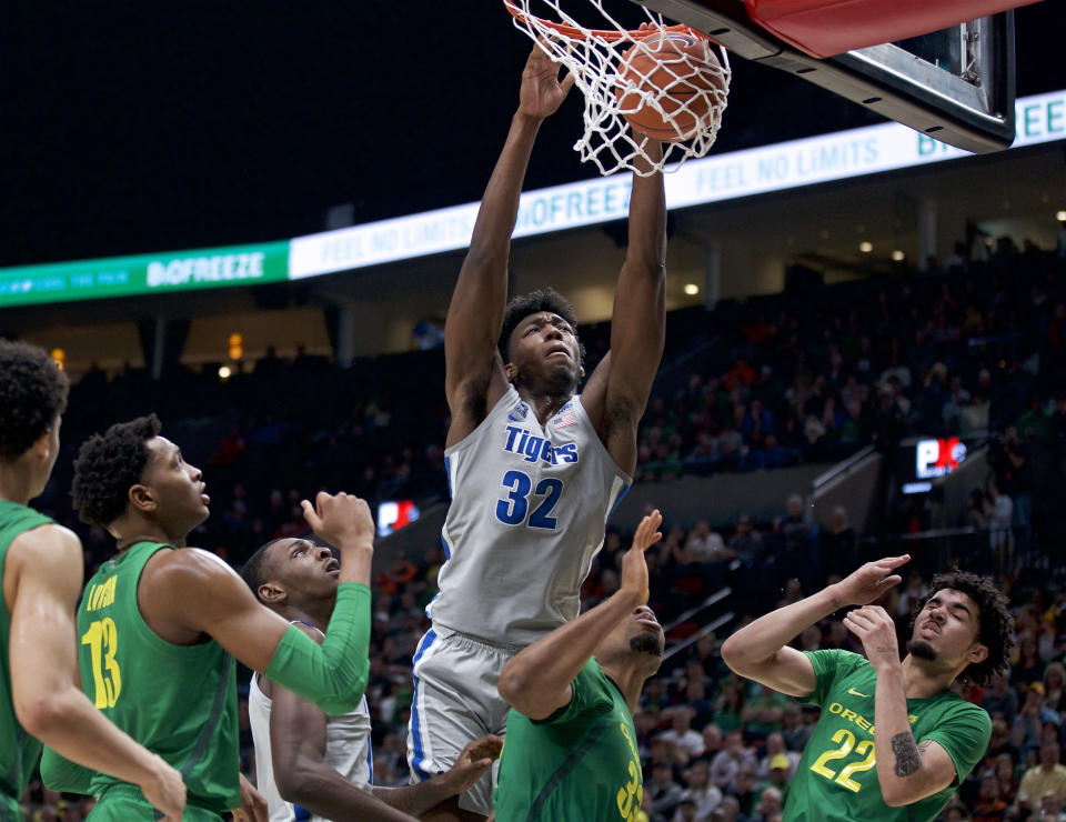 Memphis center James Wiseman (32) dunks against Oregon during the second half of an NCAA college basketball game in Portland, Ore., Tuesday, Nov. 12, 2019. Oregon won 82-74. (AP Photo/Craig Mitchelldyer)