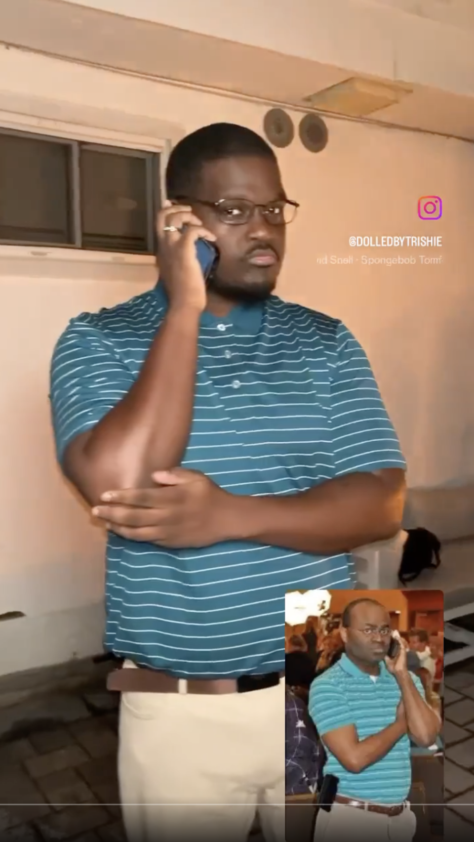man dressed in a polo and on the phone