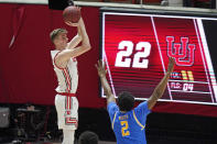 Utah center Branden Carlson shoots as UCLA forward Cody Riley (2) defends during the first half of an NCAA college basketball game Thursday, Feb. 25, 2021, in Salt Lake City. (AP Photo/Rick Bowmer)