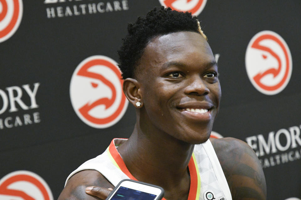 Hawks point guard Dennis Schröder meets with reporters on media day. (AP)