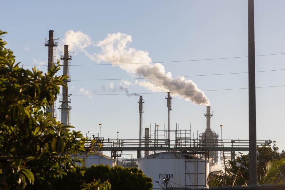 Refinery stacks rise into a hazy summer sky. Wilmington has higher than normal rates of respiratory illness, cardiac disease and asthma. It also happens to be almost 90% Hispanic.