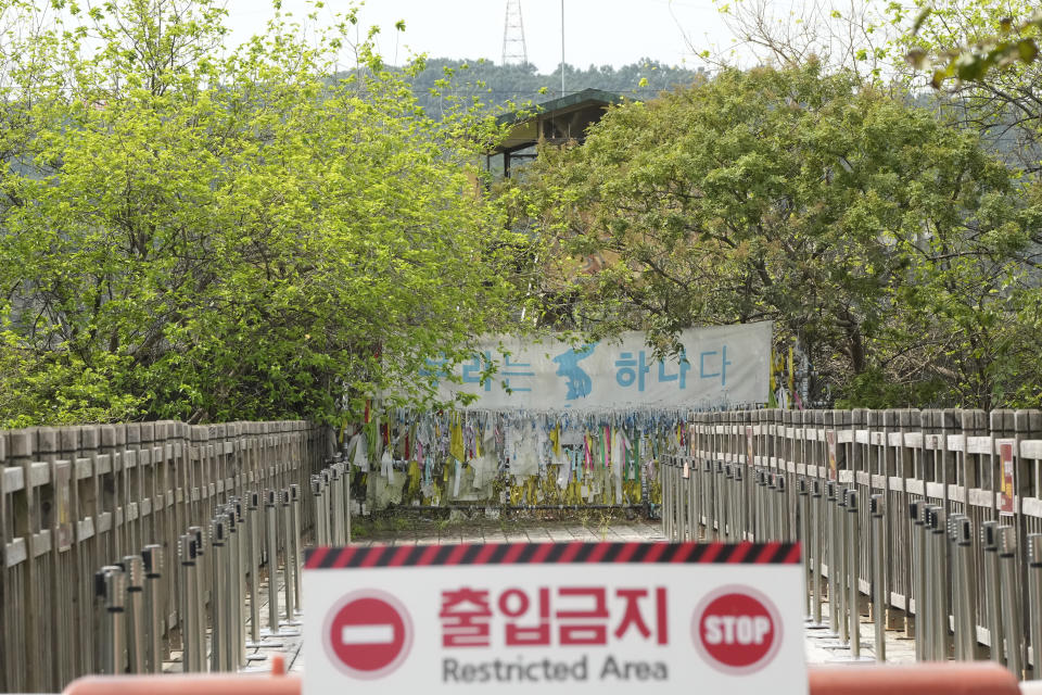 A banner and ribbons wishing reunification of the two Koreas are displayed on the wire fence at the Imjingak Pavilion in Paju, near the border with North Korea, South Korea, Friday, Sept. 24, 2021. North Korean leader Kim Jong Un’s powerful sister, Kim Yo Jong, said Friday, North Korea is willing to resume talks with South Korea if it doesn’t provoke the North with hostile policies and double standards.The banner reads: "We Are One". (AP Photo/Ahn Young-joon)