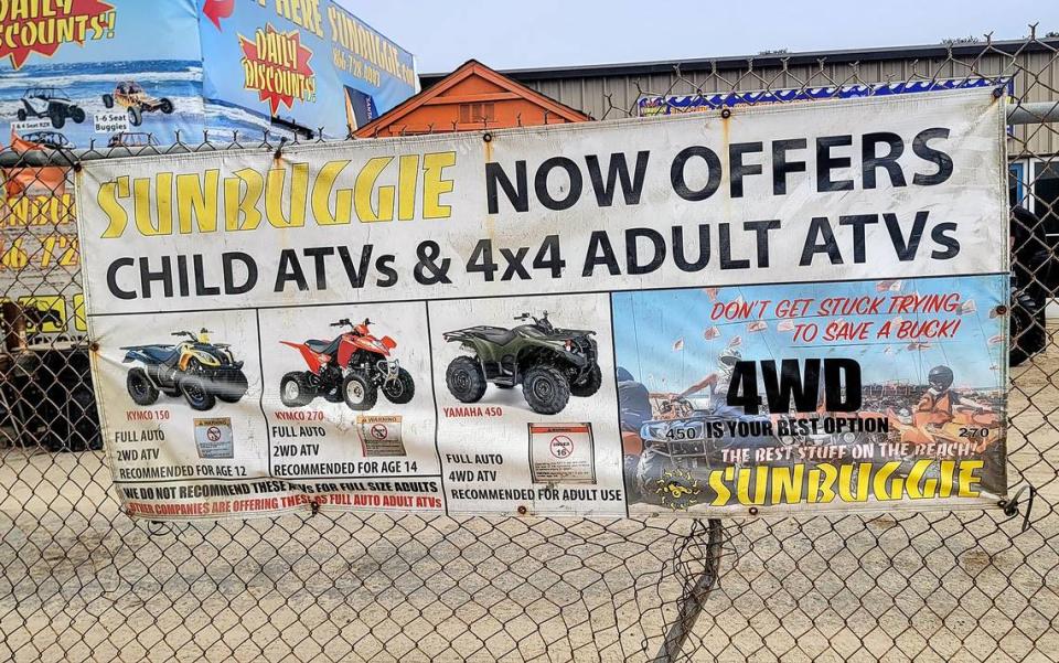 A sign posted on a fence of Sunbuggies on Pier Avenue in Oceano advertises all-terrain vehicles on Friday, July 21, 2023.