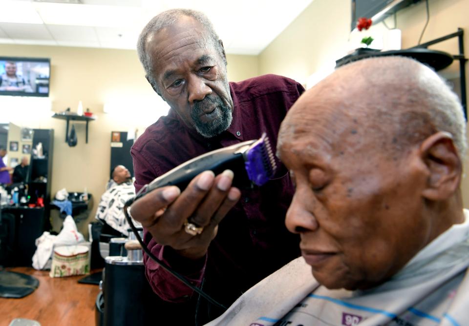 Vernon Winfrey cuts Leroy McMurray's hair at Winfrey’s barbershop in east Nashville on Jan. 11, 2018. Winfrey is the father of Oprah Winfrey.