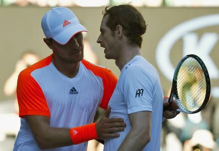 Tennis - Australian Open - Melbourne Park, Melbourne, Australia - 22/1/17 Germany's Mischa Zverev embraces after winning his Men's singles fourth round match against Britain's Andy Murray. REUTERS/Edgar