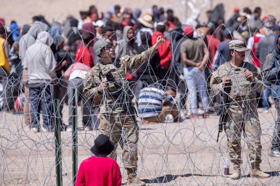 Texas National Guard soldiers keep guard on the Rio Grande at gate 42 preventing migrants from entering further into U.S. territory at the border wall in El Paso, Texas on Thursday, May 11, 2023. 