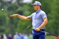 Apr 29, 2016; Avondale, LA, USA; Jamie Lovemark throws a ball to a fan after a putt on the 9th hole during the second round of the 2016 Zurich Classic of New Orleans at TPC Louisiana. Mandatory Credit: Derick E. Hingle-USA TODAY Sports