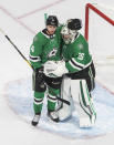 Dallas Stars' Miro Heiskanen (4) and goalie Anton Khudobin (35) celebrate the team's win over the Vegas Golden Knights in Game 4 of the NHL hockey Western Conference final, Saturday, Sept. 12, 2020, in Edmonton, Alberta. (Jason Franson/The Canadian Press via AP)