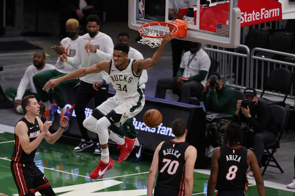 Giannis Antetokounmpo #34 of the Milwaukee Bucks reacts to a dunk against the Miami Heat during the first half of a game at Fiserv Forum on May 15, 2021 in Milwaukee, Wisconsin. NOTE TO USER: User expressly acknowledges and agrees that, by downloading and or using this photograph, User is consenting to the terms and conditions of the Getty Images License Agreement. (Photo by Stacy Revere/Getty Images)