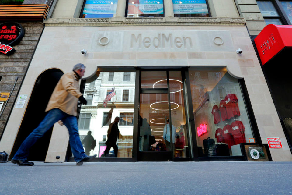 A pedestrian passes the MedMen store on New York's Fifth Avenue on April 20, 2018.