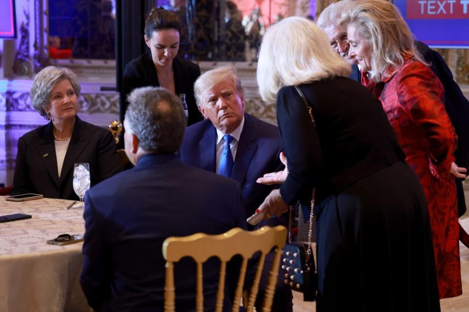 Former President Donald Trump sits with political advisers during an election night event at Mar-a-Lago on November 8, 2022 in Palm Beach, Florida. (Photo by Joe Raedle/Getty Images)