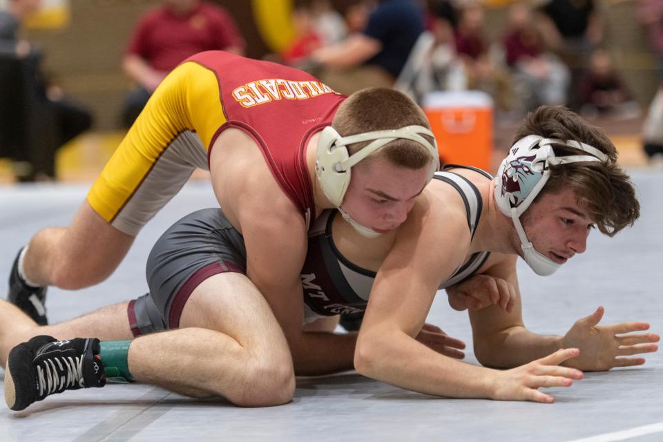 Mater Dei’s Isaiah Schaefer and Mt. Vernon’s Mason Suits compete in the 126-pound championship match of the 2024 IHSAA Wrestling Sectional tournament at Central High School in Evansville, Ind., Saturday afternoon, Jan. 27, 2024.