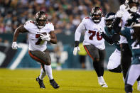 Tampa Bay Buccaneers Leonard Fournette (7) runs with the ball during the first half of an NFL football game against the Philadelphia Eagles on Thursday, Oct. 14, 2021, in Philadelphia. (AP Photo/Matt Rourke)