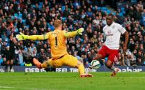 Aston Villa's Christian Benteke goes through on goal against Manchester City's Joe Hart however is later adjudged to have been offside Action Images via Reuters / Jason Cairnduff