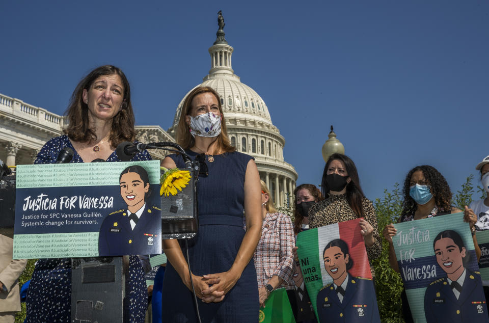 Rep. Elaine Luria, D-Va., left, and Rep. Mikie Sherrill, D-N.J. both graduates of the U.S. Naval Academy in Annapolis, Md., together with other lawmakers and supporters speaks during a news conference on Capitol Hill about ending sexual harassment and assault in the U.S. military and Department of Veterans Affairs Tuesday, July 21, 2020, in Washington. (AP Photo/Manuel Balce Ceneta)