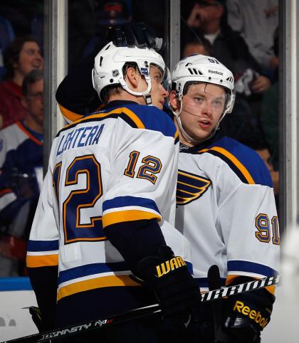 UNIONDALE, NY - DECEMBER 06: Jori Lehtera #12 and Vladimir Tarasenko #91 of the St. Louis Blues celebrate Tarasenko&#39;s insurance goal in the third period against the New York Islanders at the Nassau Veterans Memorial Coliseum on December 6, 2014 in Uniondale, New York. The Blues defeated the Islanders 6-4 (Photo by Bruce Bennett/Getty Images)