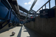 A foul ball that was hit into the stands sits on the floor of an empty stadium during the eighth inning of a baseball game between the Miami Marlins and the Philadelphia Phillies, Sunday, July 26, 2020, in Philadelphia. (AP Photo/Chris Szagola)