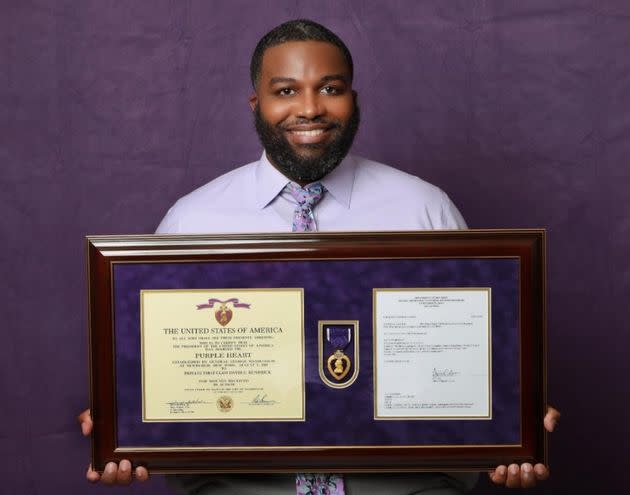 The author holding his Purple Heart medal in 2021. (Photo: Courtesy of A.S. Photo Studio)