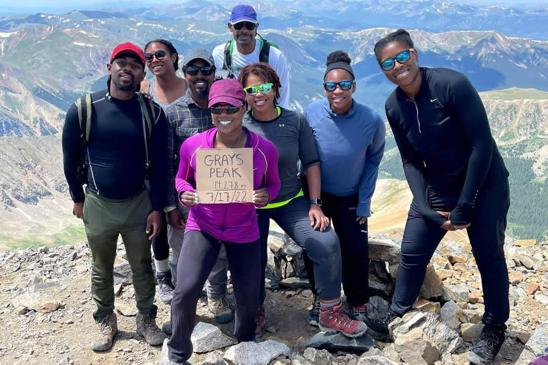 Members of Vibe Tribe Adventures gather at Grays Peak in Colorado on July 17. (Courtesy Vibe Tribe Adventures)
