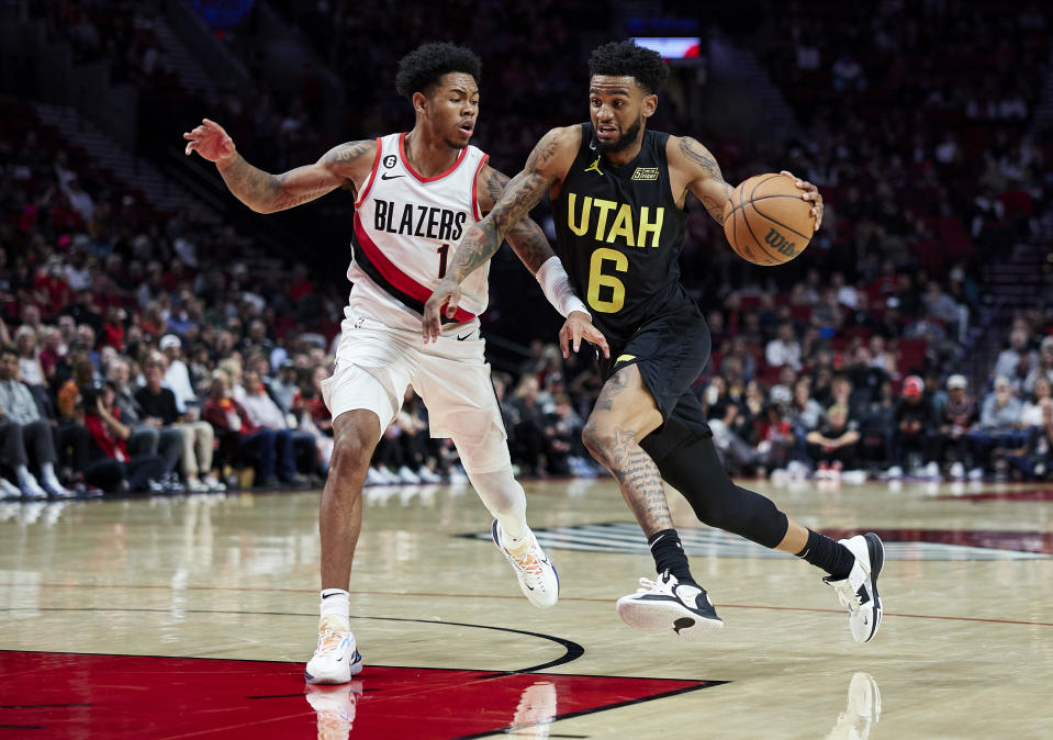 Utah Jazz guard Nickeil Alexander-Walker (6) drives past Portland Trail Blazers guard Anfernee Simons (1) during the second half of an NBA basketball game in Portland, Ore., Tuesday, Oct. 4, 2022. (AP Photo/Craig Mitchelldyer)