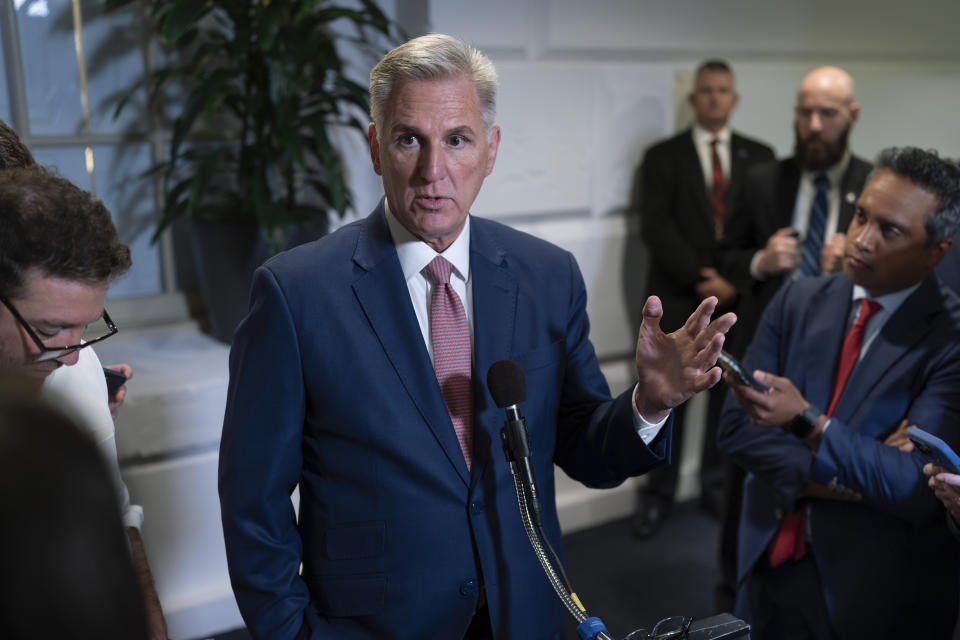 FILE - Speaker of the House Kevin McCarthy, R-Calif., talks to reporters about avoiding a government shutdown and launching an impeachment inquiry into President Joe Biden, following a closed-door meeting with fellow Republicans at the Capitol in Washington, Thursday, Sept. 14, 2023. The most vulnerable House Republicans whose elections in swing districts next year will determine which party gains control of the chamber are overwhelmingly voicing their support for House Speaker Kevin McCarthy's impeachment inquiry into President Joe Biden. It's a stance, Democrats say, that could come back to haunt them. (AP Photo/J. Scott Applewhite, File)