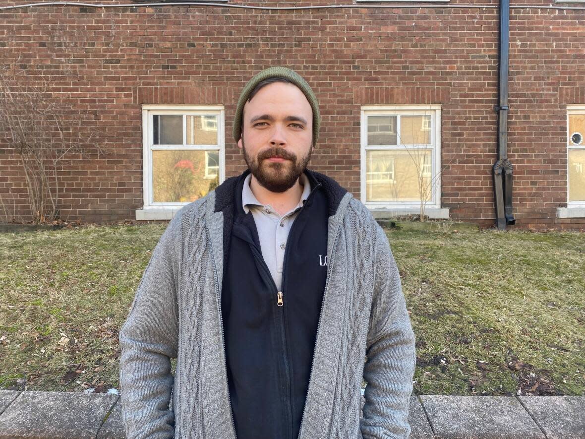 Jordan Tessier, a Toronto tenant, says of a dead raccoon rotting in the ceiling above his kitchen: 'I can't even put into words how this has completely turned my world upside down.' (Talia Ricci/CBC - image credit)