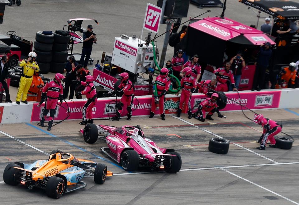 FORT WORTH, TEXAS - APRIL 02: Kyle Kirkwood, driver of the #27 AutoNation Honda and Alexander Rossi, driver of the #7 Arrow McLaren Chevrolet, spin after an incident on pit road during the NTT IndyCar Series PPG 375 at Texas Motor Speedway on April 02, 2023 in Fort Worth, Texas.