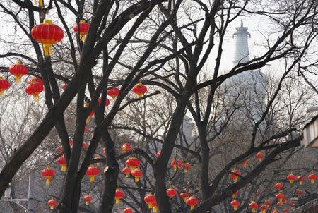 Decorations for the upcoming Chinese Lunar New Year are pictured near a park on a polluted day in Beijing, China February 13, 2018. Picture taken February 13, 2018. REUTERS/Jason Lee