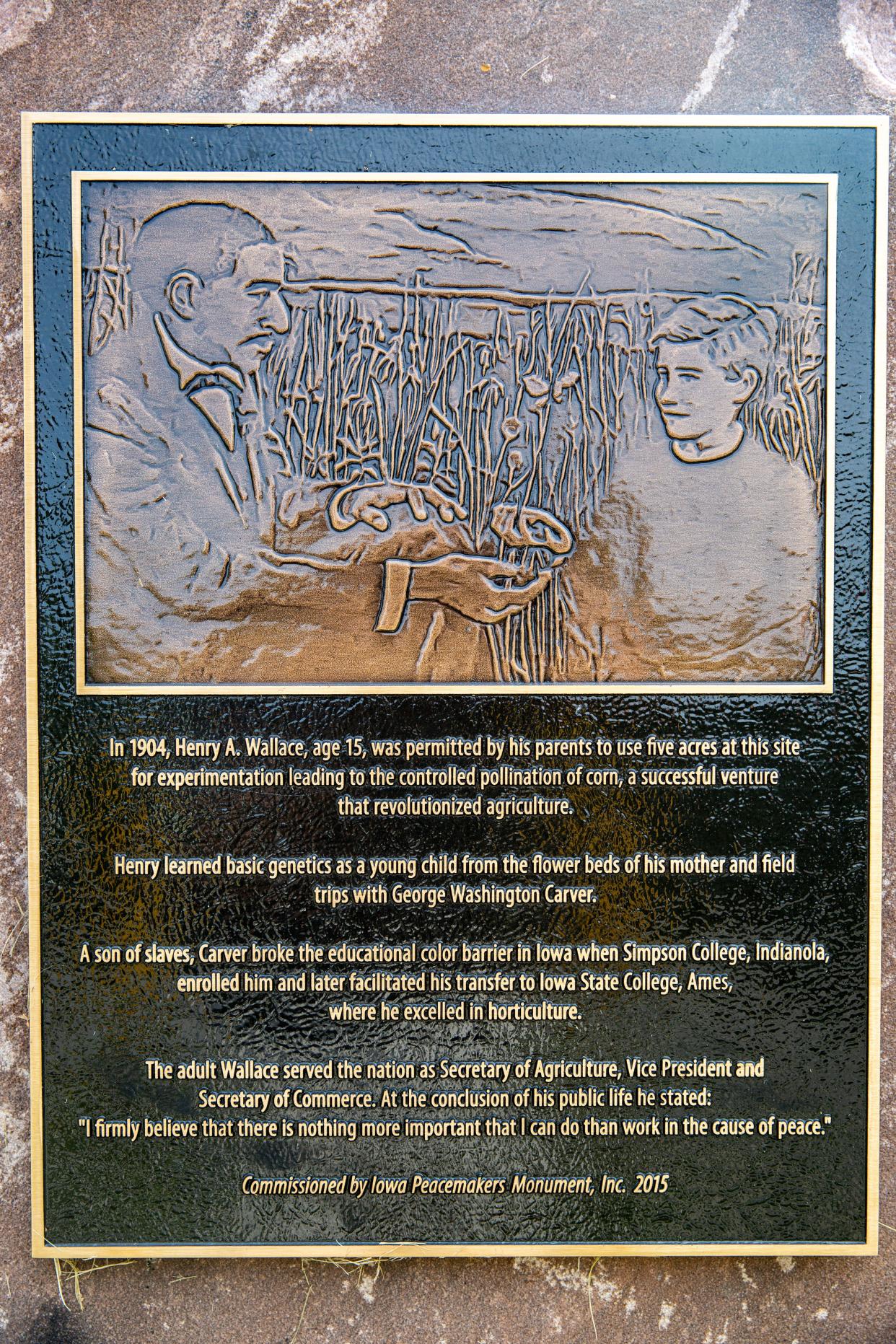 A historic marker in Des Moines' Drake neighborhood marks the spot where Henry A. Wallace, influenced as a boy by George Washington Carver, experimented with growing strains of corn.