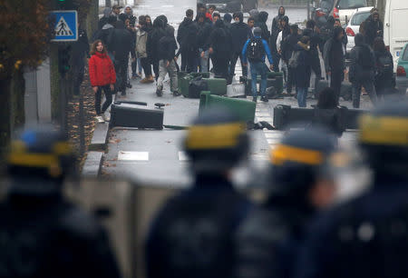 French riot police face off with youth and high school students during a protest against the French government's reform plan, in Bordeaux, France, December 6, 2018. REUTERS/Regis Duvignau