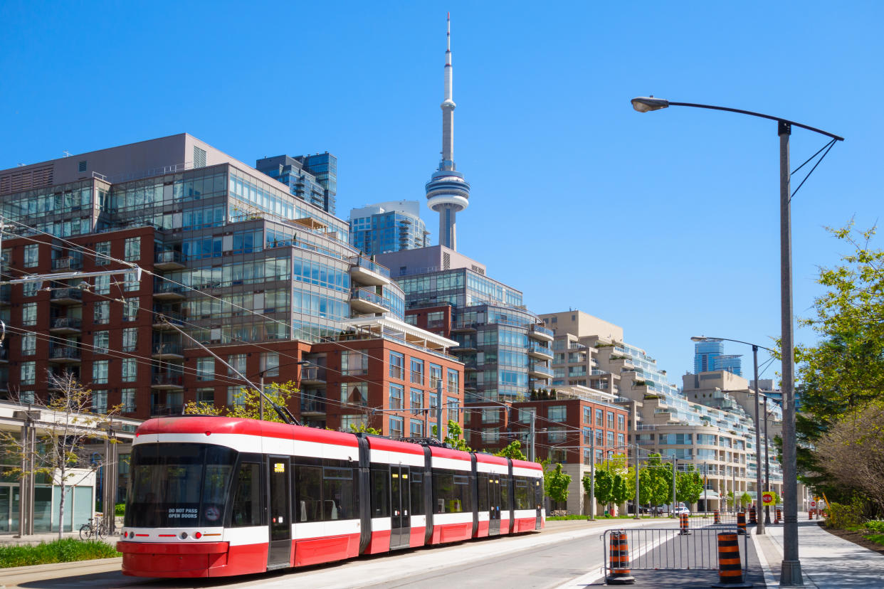 Queen's Quay West street car and new condominium buildings in downtown Toronto