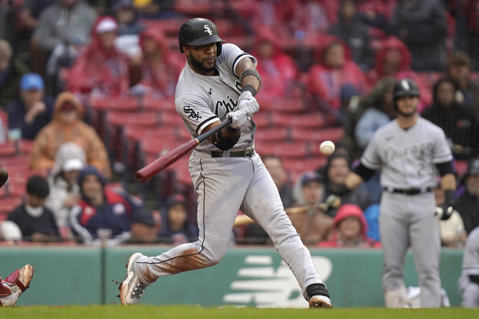Chicago White Sox's Elvis Andrus hits a two-run double in the fifth inning of a baseball game against the Boston Red Sox, Sunday, Sept. 24, 2023, in Boston. (AP Photo/Steven Senne)