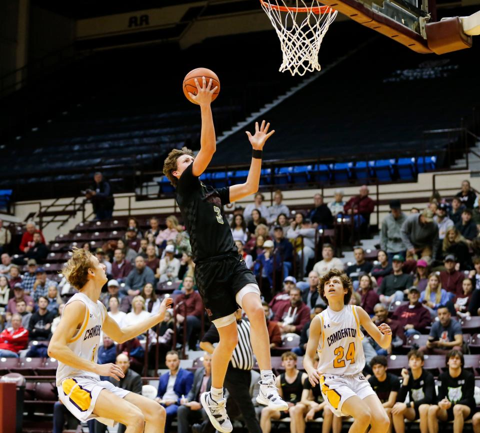 Logan-Rogersville's Chase Branham goes up for a field goal as the Wildcats took on the Camdenton Lakers in the first round of the Blue Division during the Blue and Gold Tournament at Hammons Student Center on Tuesday, Dec. 26, 2023.