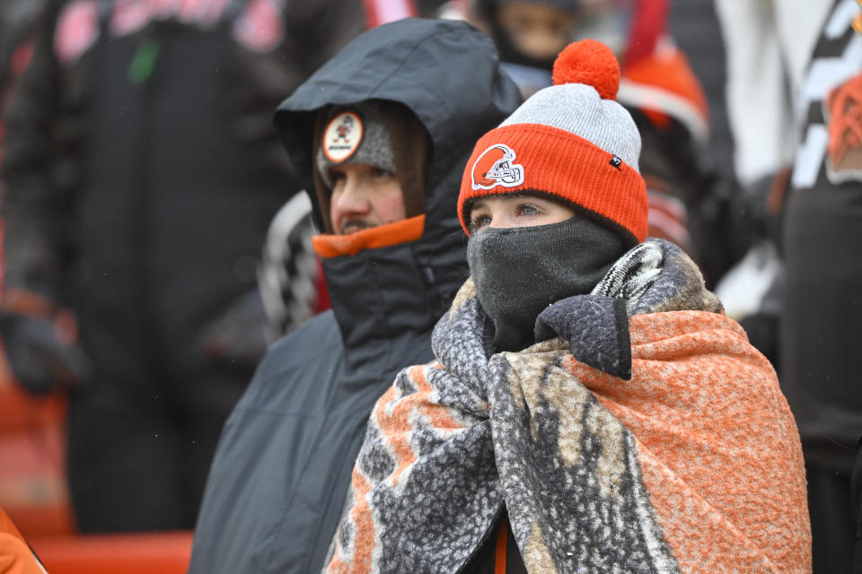 Cleveland Browns fans watch from the Dawg Pound during the first half of an NFL football game against the New Orleans Saints, Saturday, Dec. 24, 2022, in Cleveland. (AP Photo/David Richard)